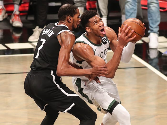 Milwaukee Bucks forward Giannis Antetokounmpo (34) drives past Brooklyn Nets forward Kevin Durant (7) in the third quarter during game seven in the second round of the 2021 NBA Playoffs